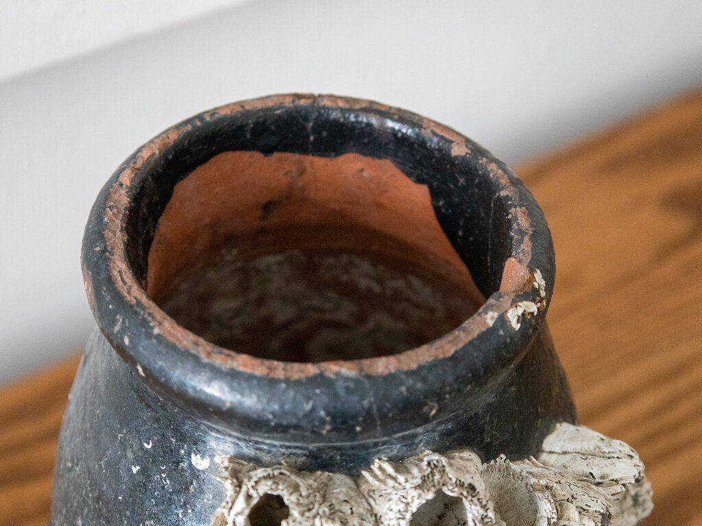 Antique Antique Japanese Octopus jar with black glaze and large barnacles