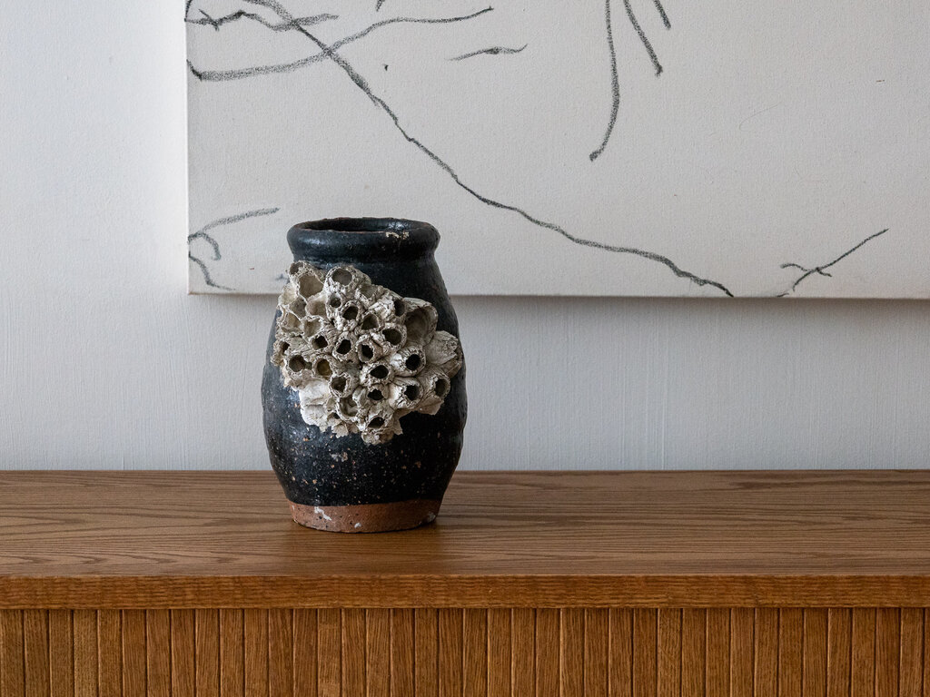 Antique Antique Japanese Octopus jar with black glaze and large barnacles