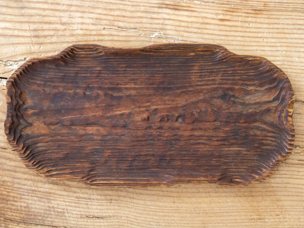 A striking worn cedar tray