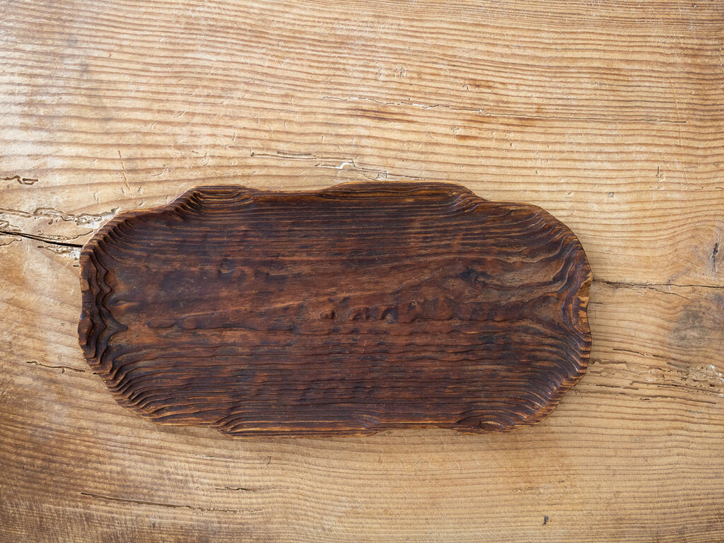 A striking worn cedar tray