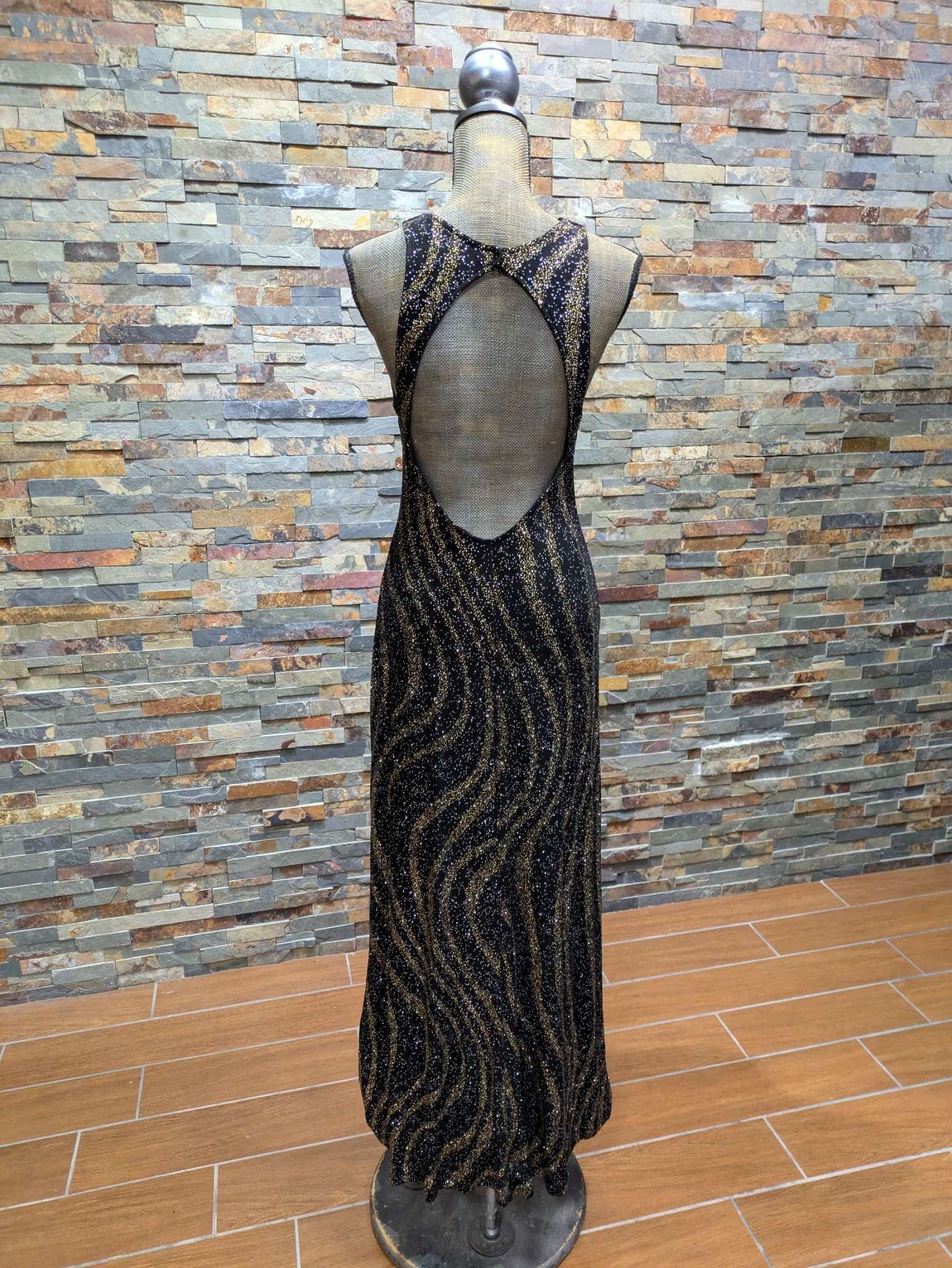 black and gold pattern dress GOLD PATTERN KNIT DRESS WITH PLUNGING NECKLINE main image 1