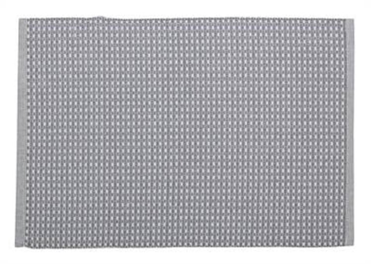 Napperon à motifs blancs et gris