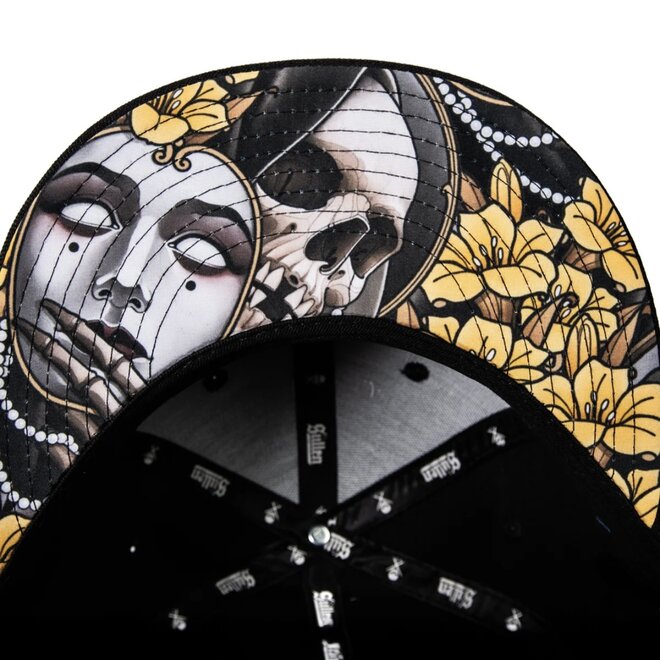 BENEATH SNAPBACK HAT