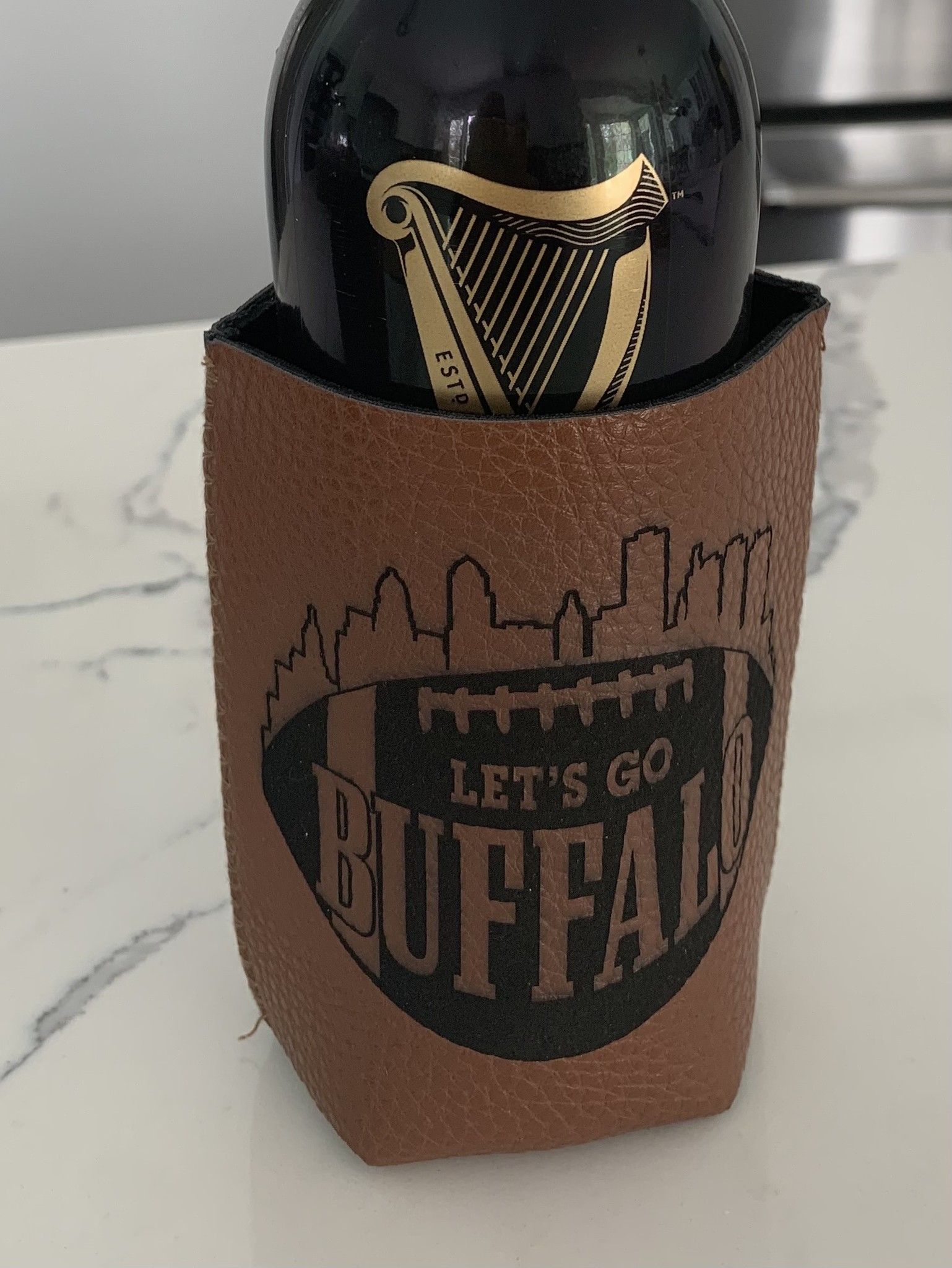 https://cdn.shoplightspeed.com/shops/637551/files/53670990/leather-buffalo-football-koozie-brown.jpg