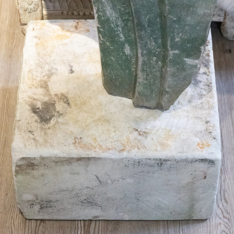 Signed stone sculpture featuring profile of three women. Artist signed "Marince"