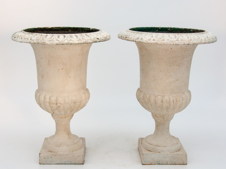 Pair of white cast iron urns, small