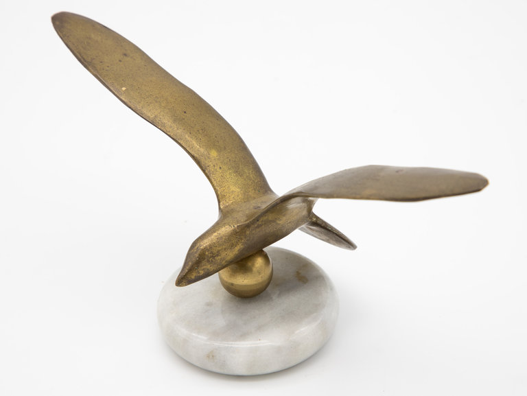 Brass bird in Flight on marble base