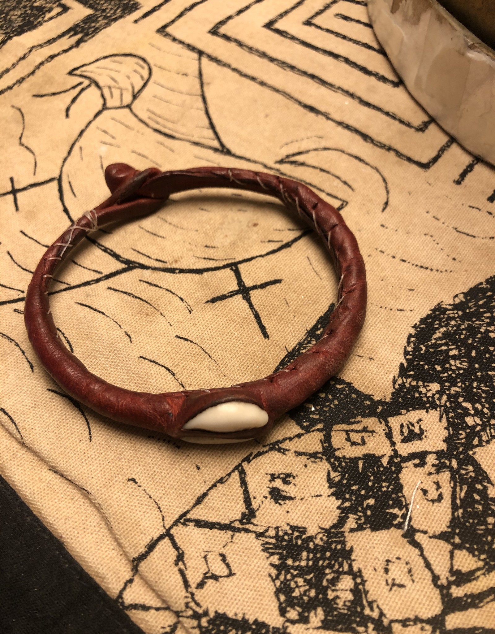 Red leather bracelet with cowrie