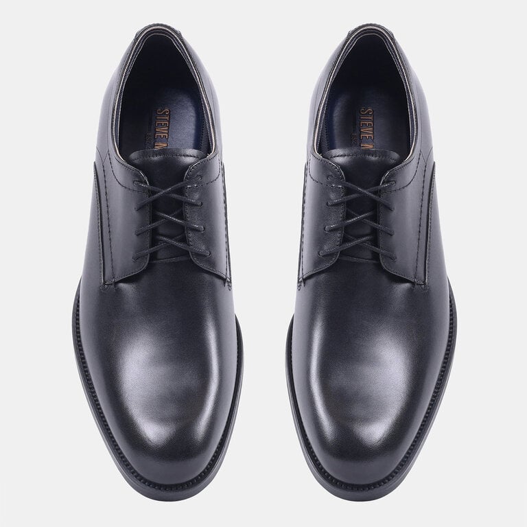 Steve Madden Steve Madden - Helfant - Men’s Leather Dress Shoe - Black / Brown LeatherThe dress shoe with a sole that holds the floor. Steve Madden’s Helfant is polished leather set on a rubber sole, so it grips where a slick leather sole would slide. Office to evenin