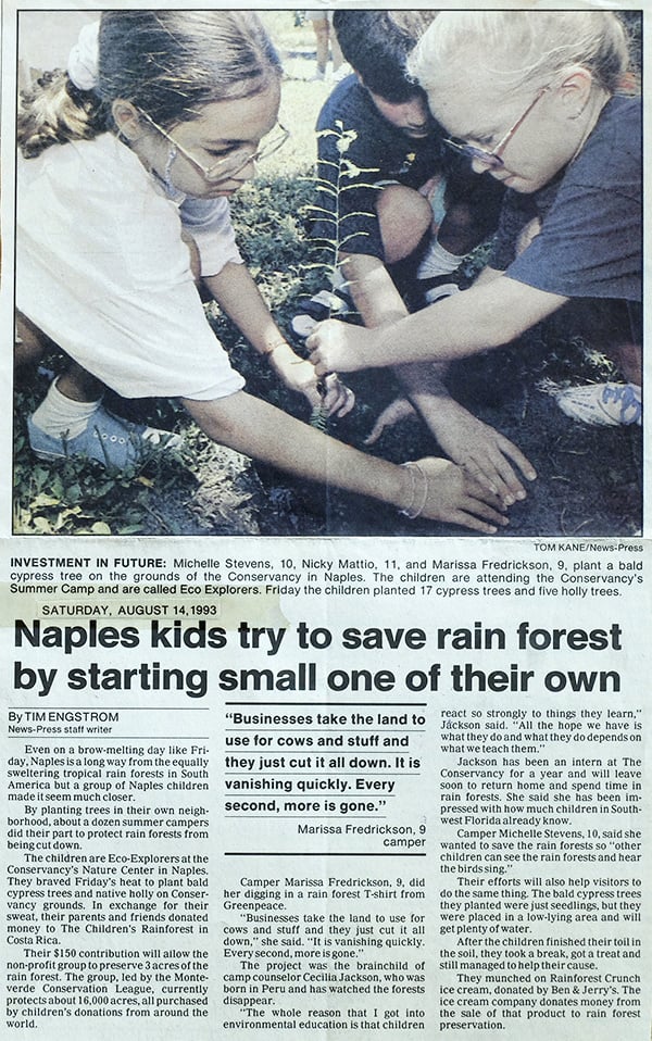 Newspaper clipping shows image of Michelle Stevens and other children panting trees