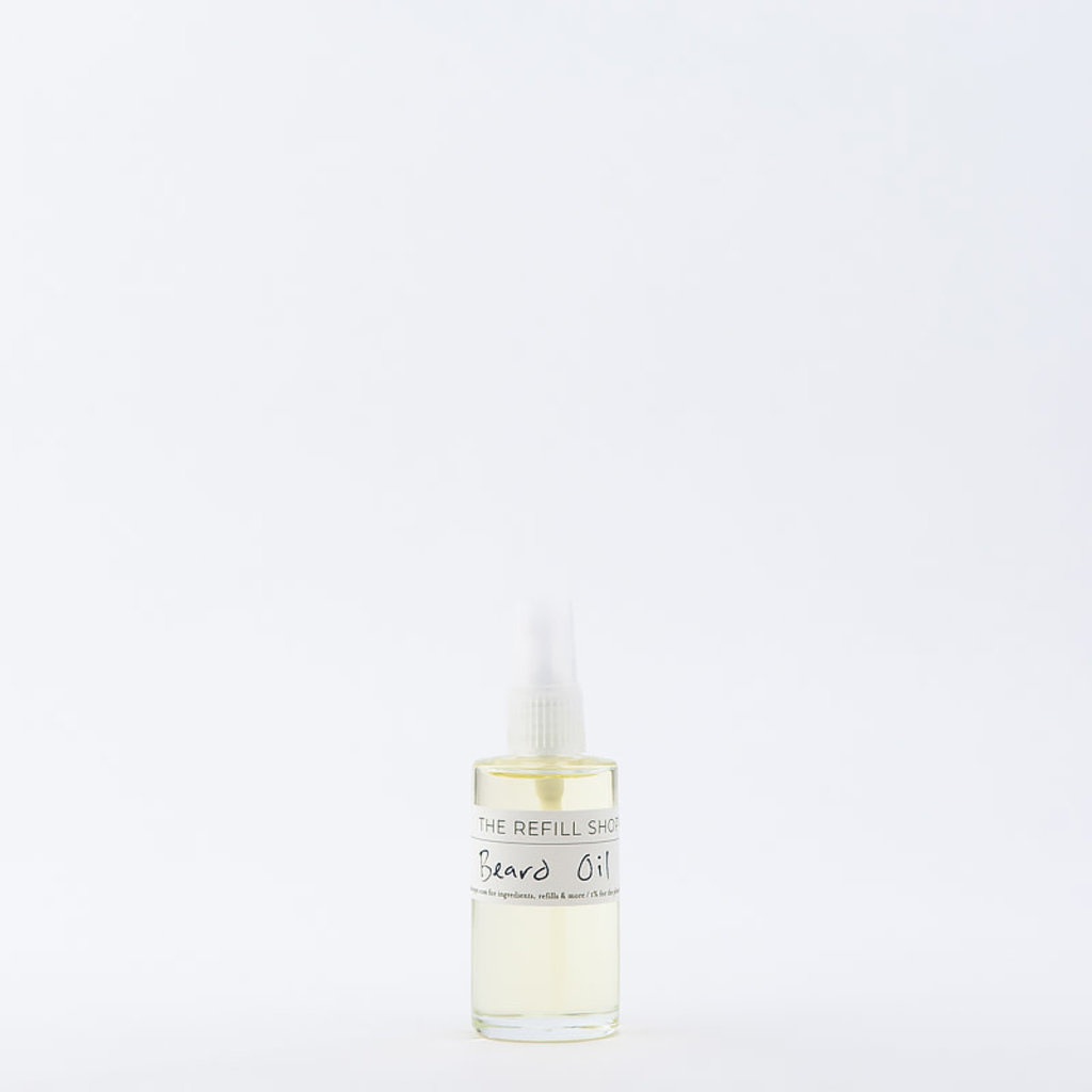 Clear glass bottle of beard oil