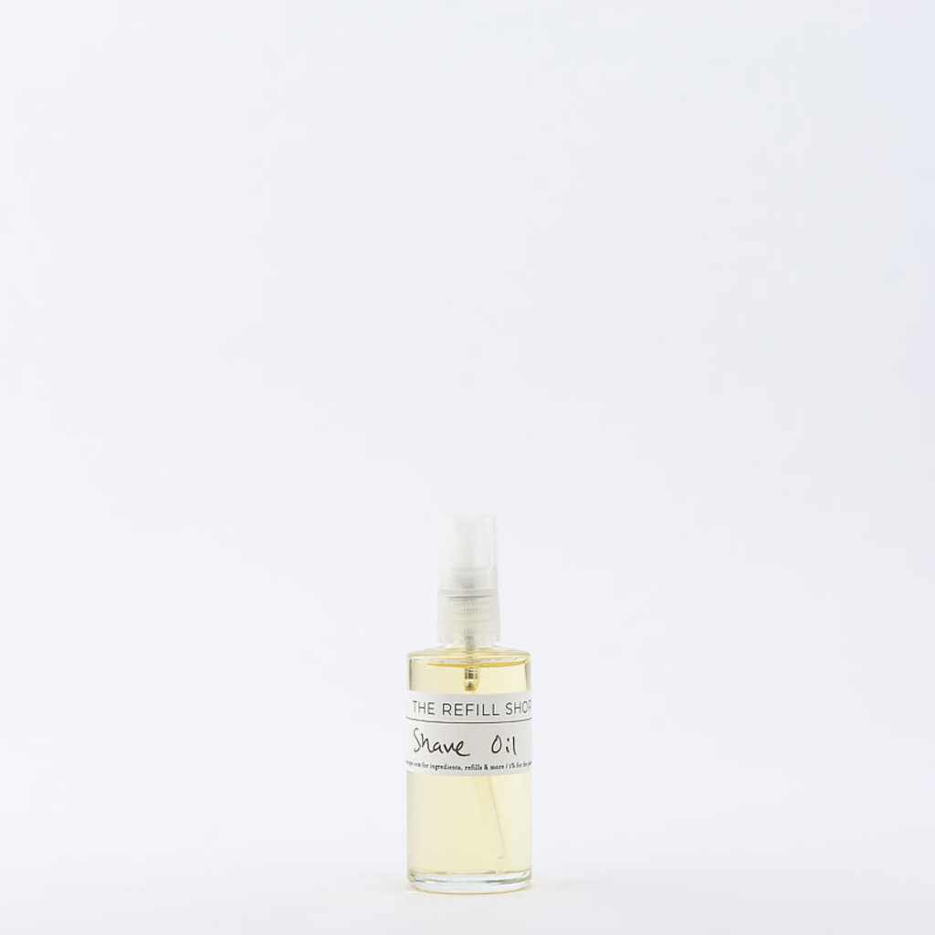 Clear glass bottle of shave oil