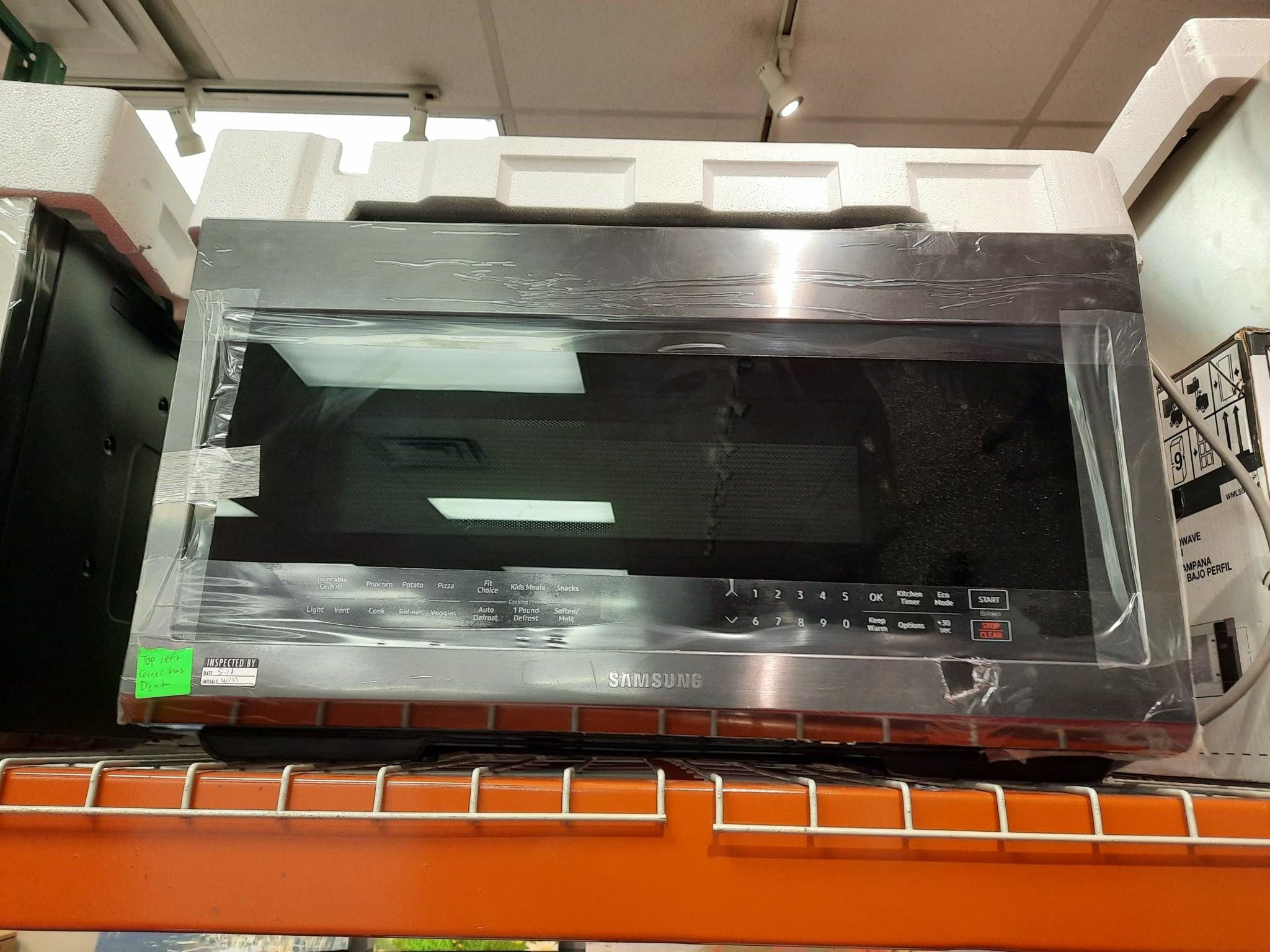 Samsung Samsung ME21M706BAG  2.1-cu ft Over-the-Range Microwave with Sensor Cooking (Fingerprint Resistant Black Stainless Steel)