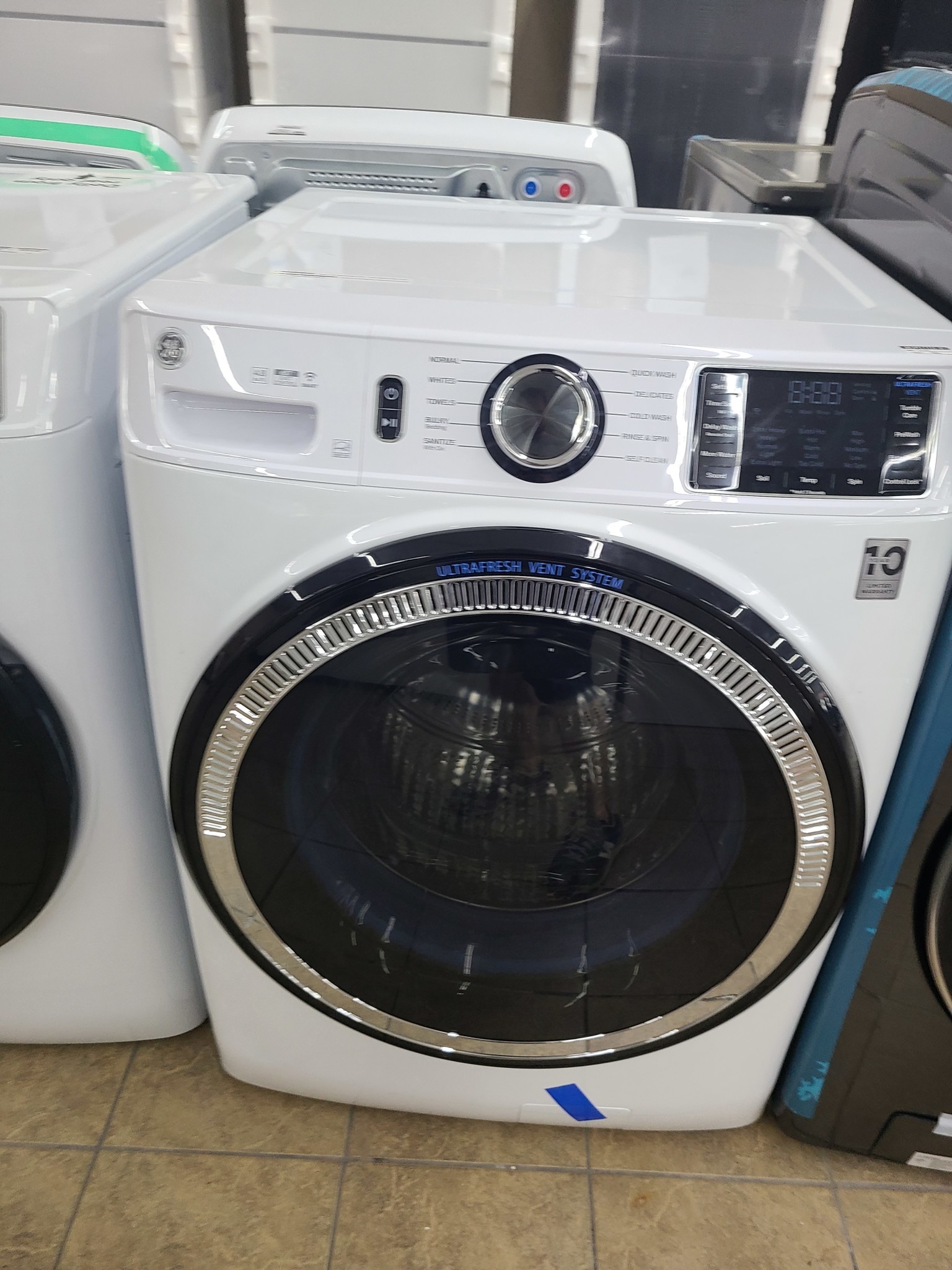 GE GE GFW550SSNWW 32 i 4.8 cu. ft. White Front Load Washing Machine with OdorBlock UltraFresh Vent System and Sanitize with Oxi