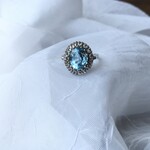 Franklin Jewelers 10kt W Oval Blue Topaz and diamond halo ring