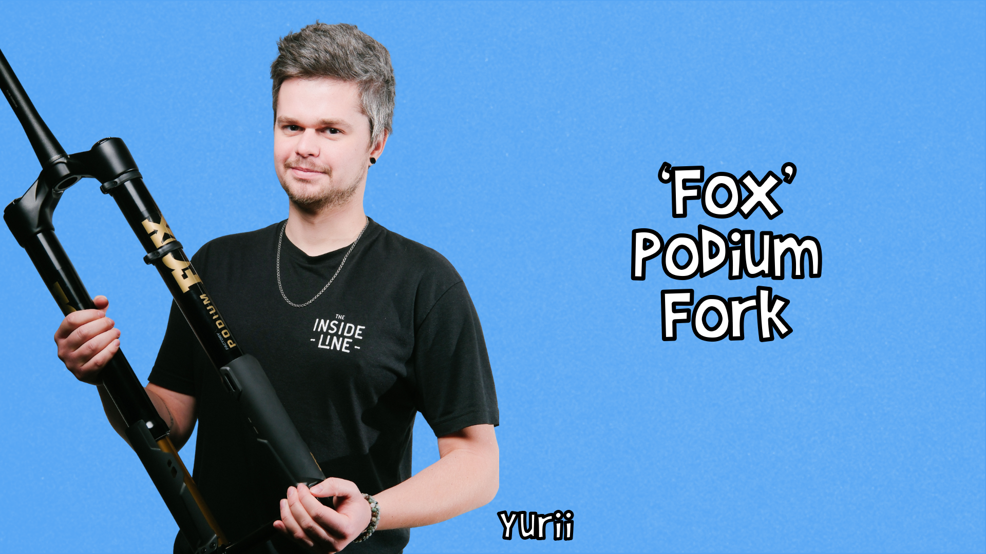 Yurii holding a Fox Podium fork