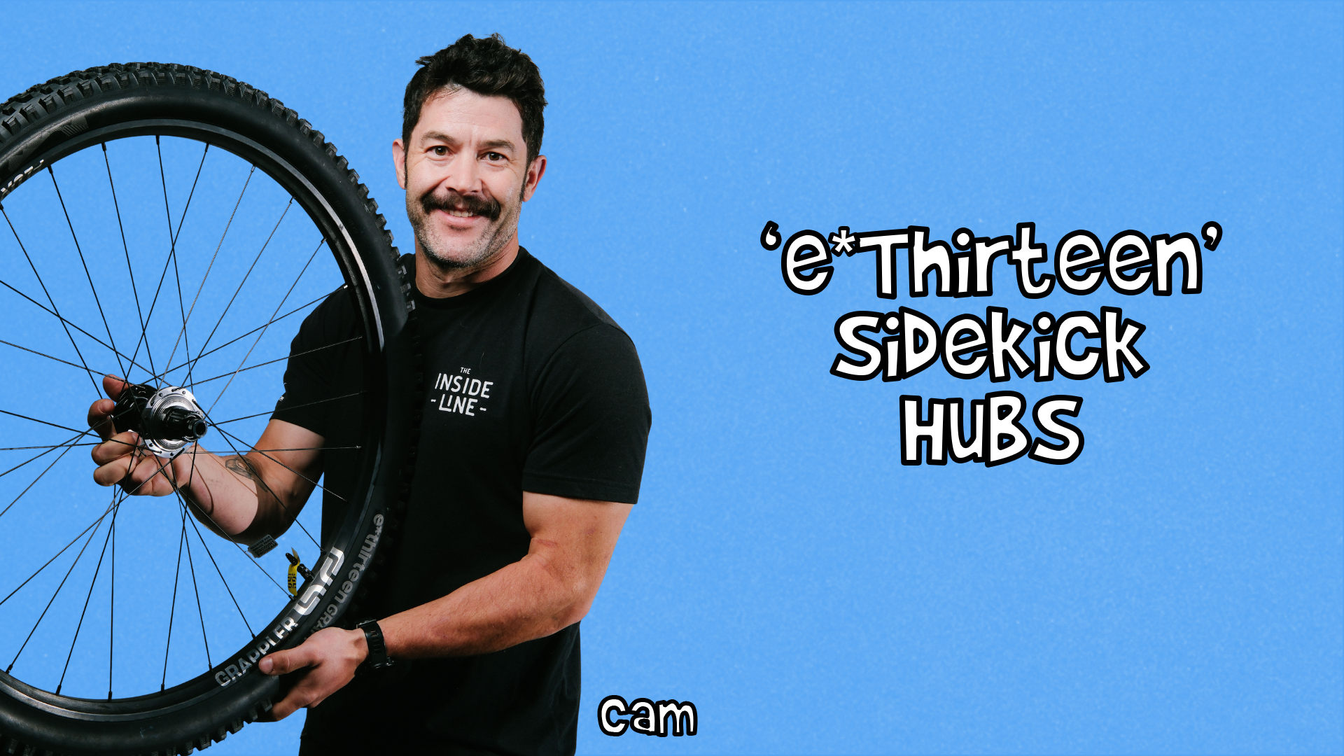 Cam holding a wheel laced with a Sidekick hub