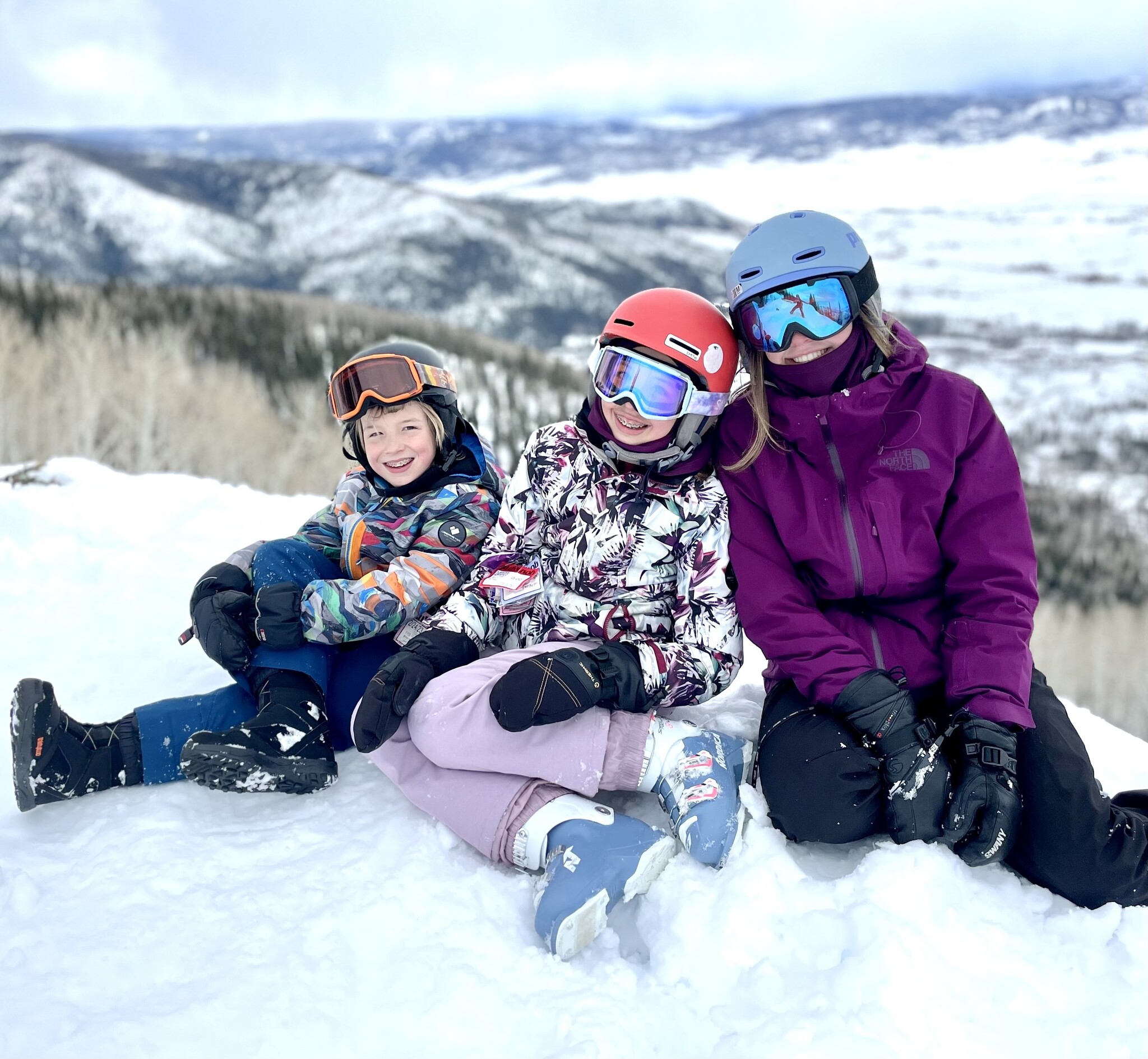 Sun & Snow helping a young skier with ski equipment