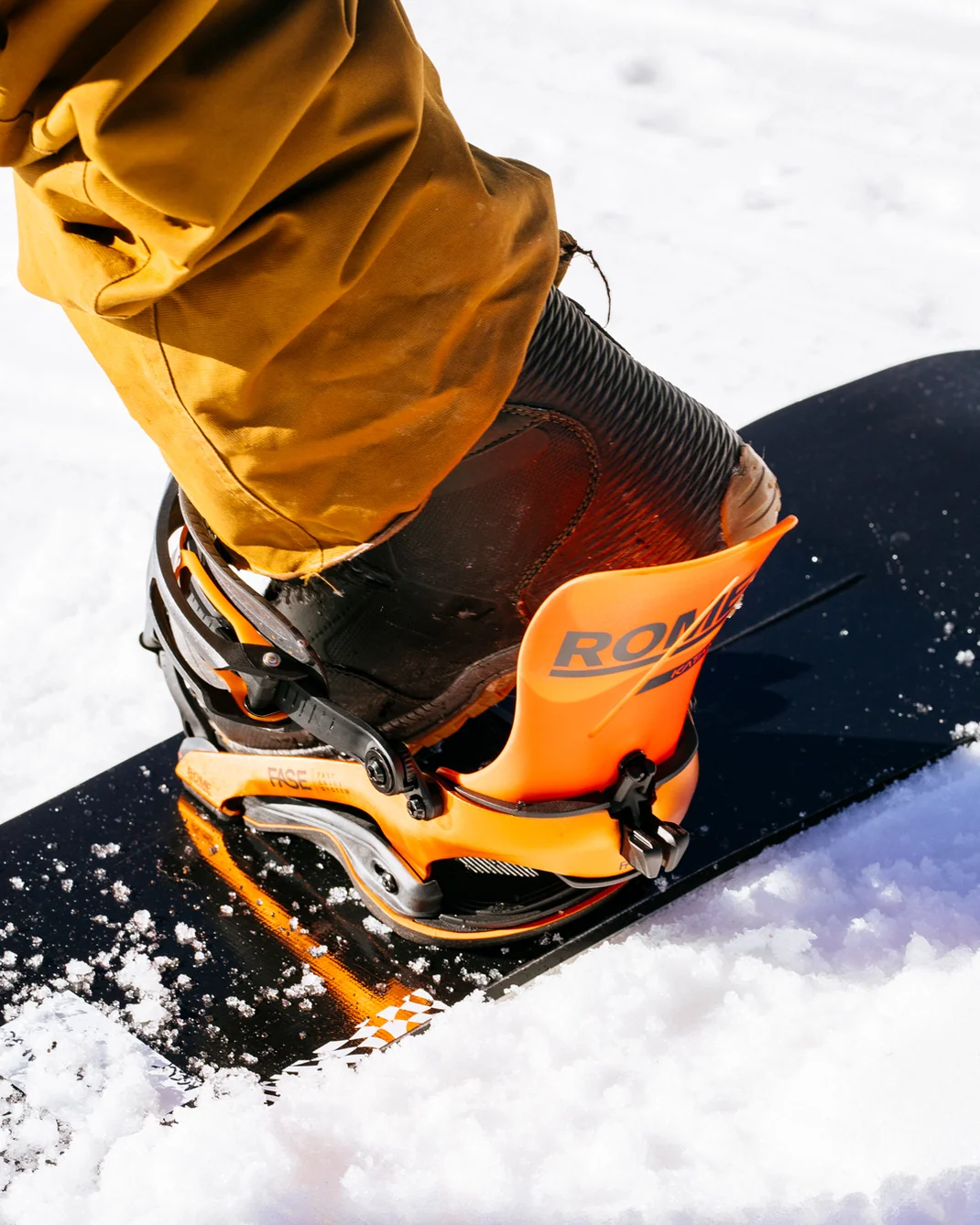 Rome FASE snowboard bindings being used by snowboard riders on snow