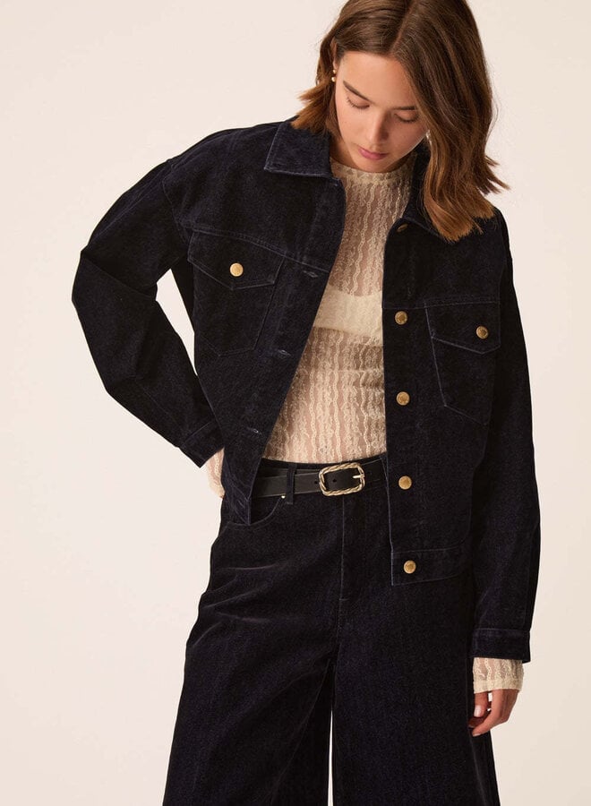 Ceinture Des Petits Hauts Naomi en cuir noir avec boucle torsadée dorée