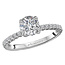 Romance This 14kt white gold semi-mount engagment ring has round micro set diamonds aligning the shank on both sides of a setting that will accommodate a 6.5mm round diamond. (D 1/4 carat total weight)
