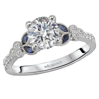 Romance Diamonds line the shank of this beautiful ring and marquise cut sapphires are on either side of a setting that will accommodate a 6.5mm round diamond.  (D 1/8 carat total weight, S 1/5 carat total weight)