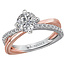 Romance Dazzling engagement ring created in high polished 14kt white and rose gold showcases brilliant cut diamonds aligning the criss cross shank. (D 1/5 carat total weight)