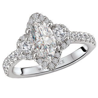 Romance This elegant ring features a 3-stone look with a marquise halo center created with round sparkling diamonds set in 14kt white gold. (D 1/2 carat total weight)
