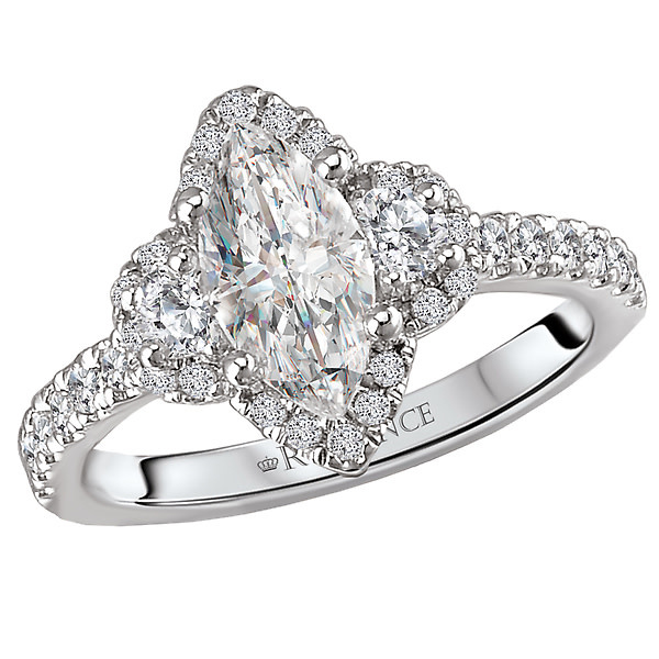 Romance This elegant ring features a 3stone look with a marquise halo