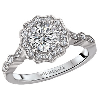Romance This semi-mount ring features a scalloped halo of sparkling round diamonds set in high polished 14kt white gold with a fancy shank and a center setting that will accommodate a 6.5mm round diamond. (D 1/5 carat total weight)