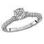 Romance This high polished 14k white gold engagement ring has an abundance of sparkling diamonds lining the shank and a center setting that will accommodate a 5.2MM round diamond. (D 1/4 carat total weight)