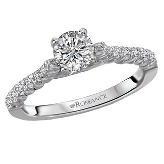 Romance This high polished 14k white gold engagement ring has an abundance of sparkling diamonds lining the shank and a round 1/2ct diamond in the center.  (D 3/4 carat total weight)