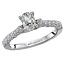 Romance This high polished 14k white gold engagement ring has an abundance of sparkling diamonds lining the shank and an oval shaped 1/2ct diamond in the center.  (D 3/4 carat total weight)