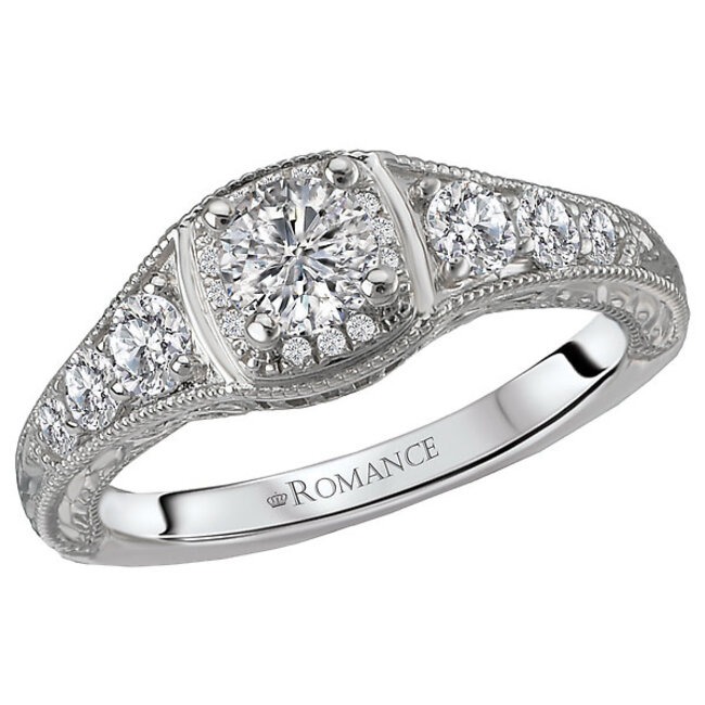 Romance This ring showcases milgrain detail with round sparkling graduated diamonds set in high polished 14kt white gold. (D 1/6 carat total weight)