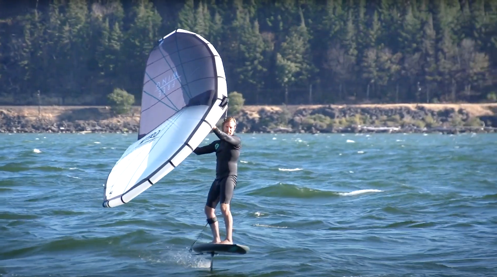 A wingfoiler trying a smaller foil