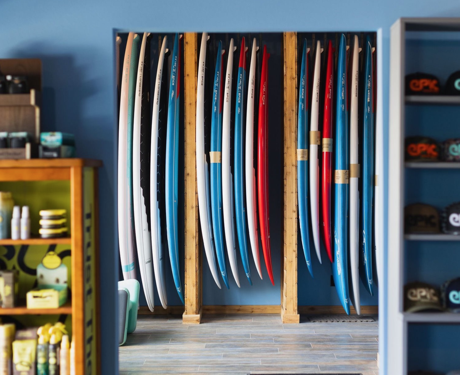 Paddleboards displayed in the Epic Boardsports shop in Cocoa Beach, Florida, available for SUP rentals and demos.
