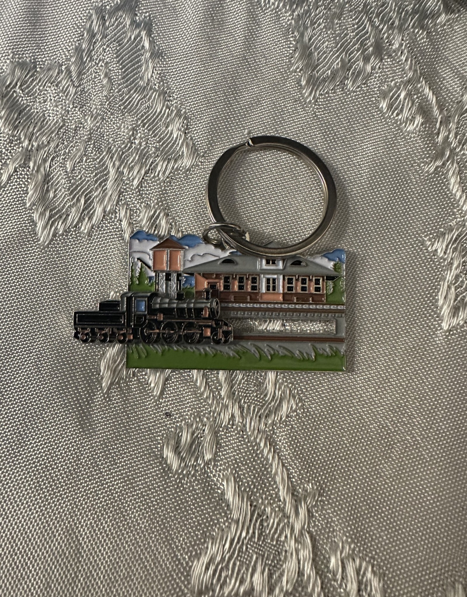 Charles Products Metal Keychain with Sliding Train