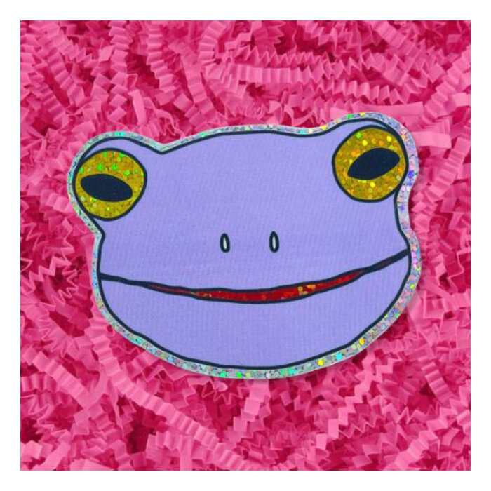 https://cdn.shoplightspeed.com/shops/639674/files/57320978/700x700x1/jenny-lemons-jenny-lemons-lilac-frog-face-sticker.jpg