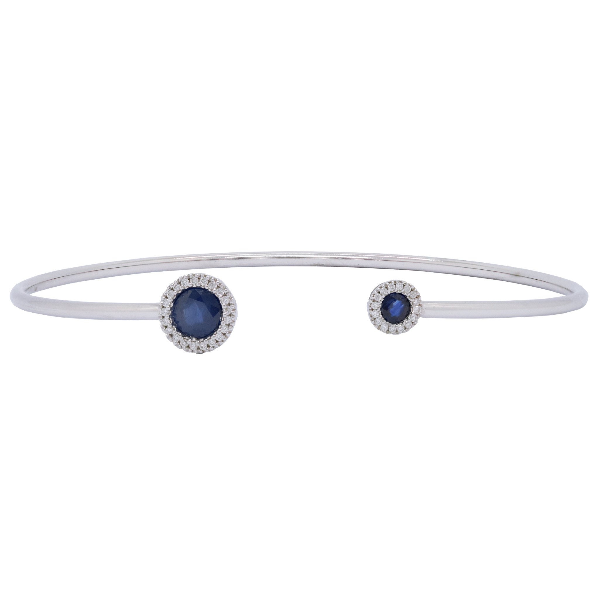 Handmade Blue sapphire bracelet is surrounded by shining green Tsavorite &  diamonds.