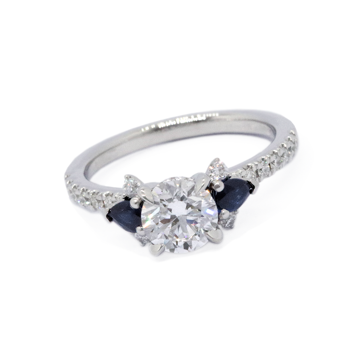 A diamond engagement ring with sapphire side stones