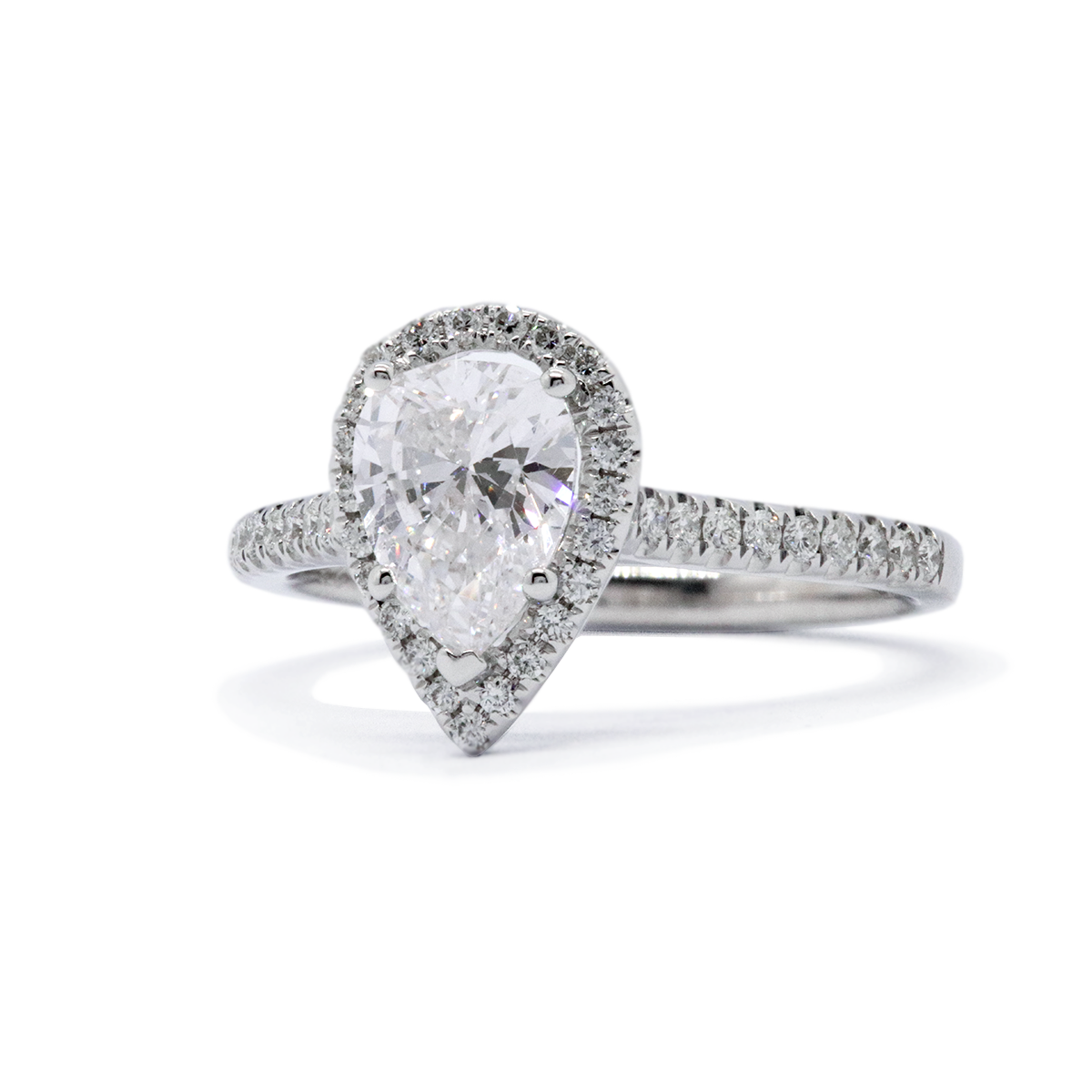 A Pear shaped diamond halo engagement ring