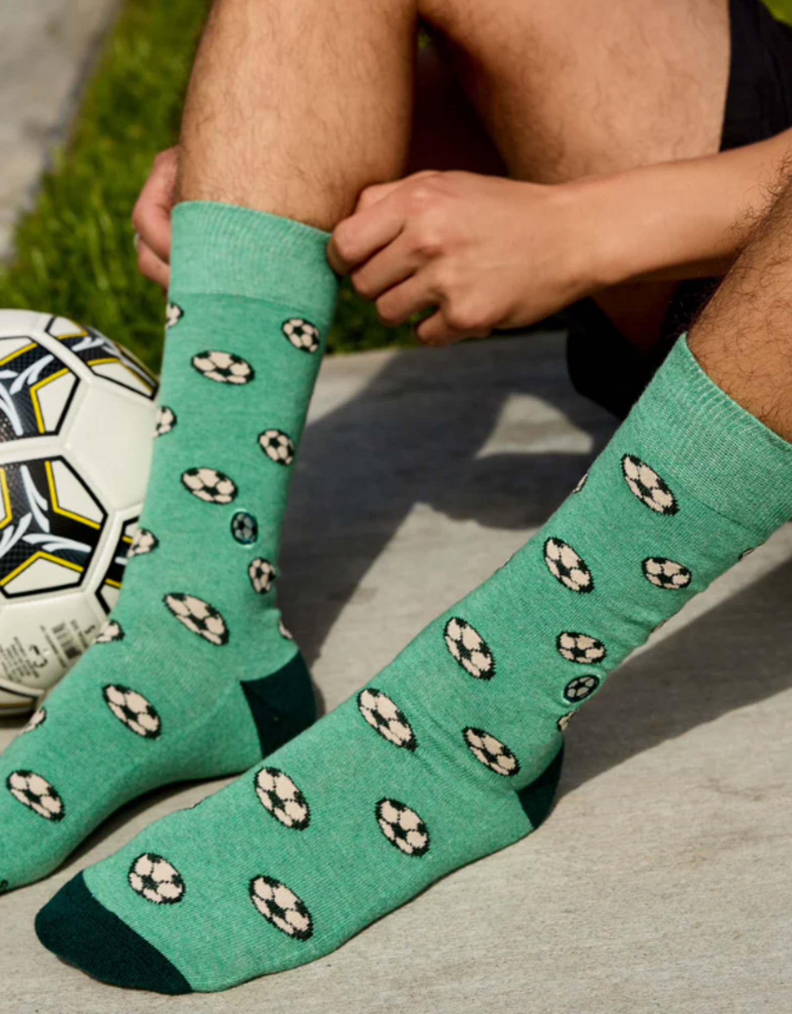 Conscious Step Socks that Support Youth Sports (Green Soccer Balls)