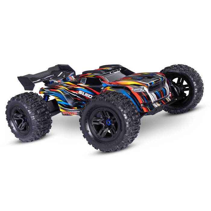 Traxxas Sledge® 1/8 scale 4WD brushless monster truck. Fully assembled, Ready-To-Race®, with TQi™ 2.4GHz radio system, VXL-6s™ power system, belted Sledgehammer® tires, and ProGraphix® clipless body.
