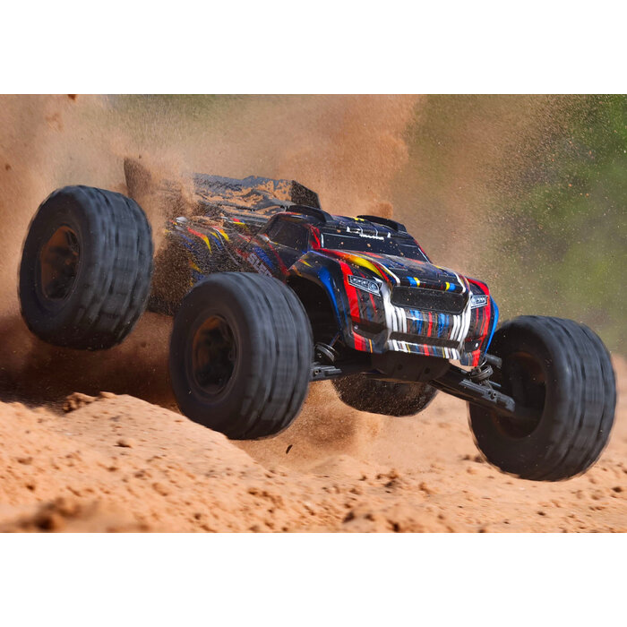 Traxxas Sledge® 1/8 scale 4WD brushless monster truck. Fully assembled, Ready-To-Race®, with TQi™ 2.4GHz radio system, VXL-6s™ power system, belted Sledgehammer® tires, and ProGraphix® clipless body.