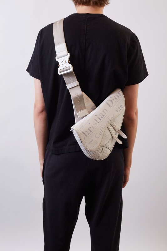 DIOR X DANIEL ARSHAM GRAINED CALFSKIN WHITE NEWSPAPER PRINT SADDLE BAG CRTBLNCHSHP