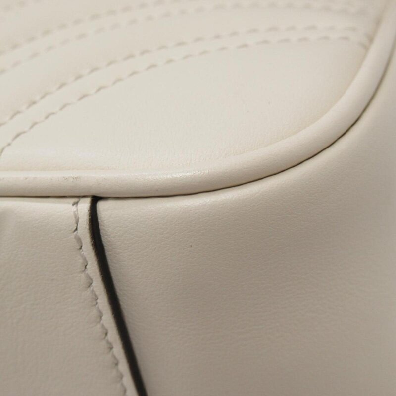 GUCCI GUCCI GG MARMONT SMALL LEATHER MATELASSE SHOULDER BAG IVORY WHITE