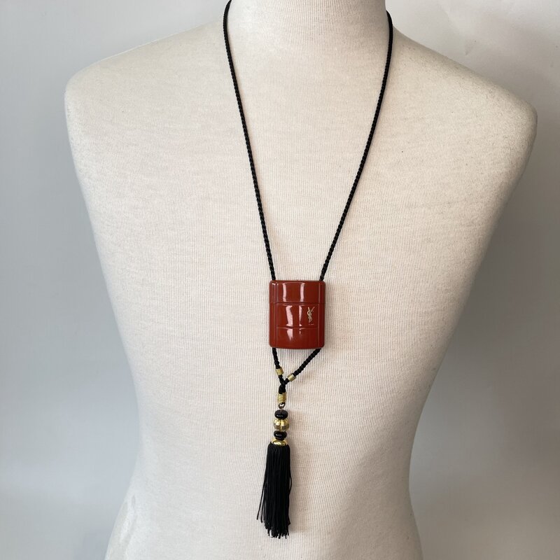YVES SAINT LAURENT VINTAGE OPIUM CHARM ROPE NECKLACE WITH TASSLE 1980's
