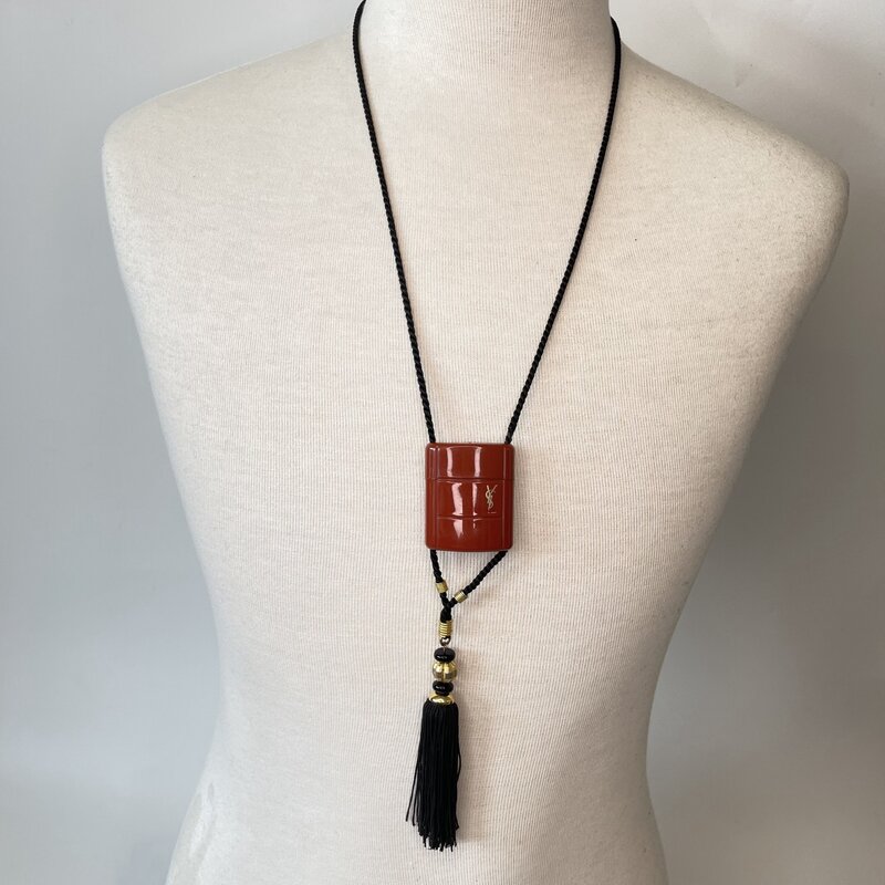 YVES SAINT LAURENT YVES SAINT LAURENT VINTAGE OPIUM CHARM ROPE NECKLACE WITH TASSLE 1980's