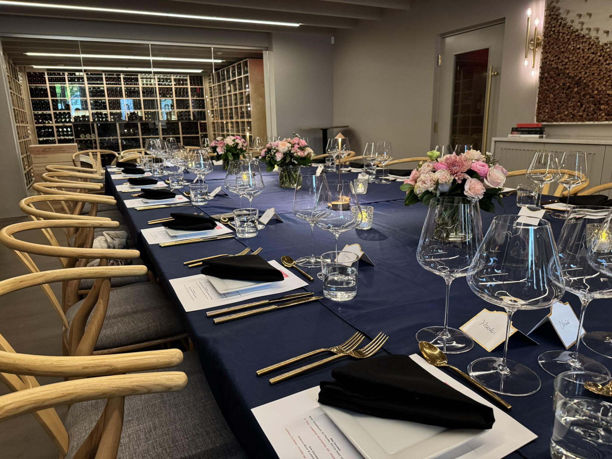 Large table dinner with the wine cellar as a backdrop