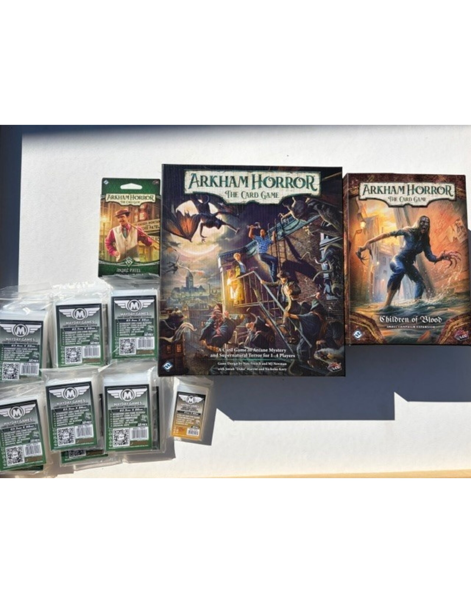 Fantasy Flight Games Arkham Horror: The Card Game Bundle Includes: Base game + Andre Patel Investigator Deck + Children of Blood Small campaign expansion (NIS) Fully Sleeved